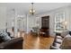 Elegant living room showcases hardwood floors, columns, and comfortable seating arrangement at 5619 Bennettwood Ct, Raleigh, NC 27612