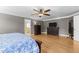 A spacious main bedroom showcasing a dresser and a glimpse into the primary bathroom at 5619 Bennettwood Ct, Raleigh, NC 27612