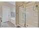 Bathroom featuring a separate bathtub and glass-enclosed shower for a luxurious bathing experience at 636 Ginger Mint Cir, Knightdale, NC 27545