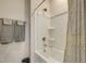 Clean bathroom showcasing a bathtub with a shower and a neutral-patterned shower curtain at 636 Ginger Mint Cir, Knightdale, NC 27545