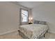 Bright bedroom with paisley bedding, natural light, and neutral colored walls at 636 Ginger Mint Cir, Knightdale, NC 27545