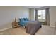 Cozy bedroom with soft carpet, a large window, and comfortable furnishings for a restful retreat at 636 Ginger Mint Cir, Knightdale, NC 27545