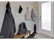 Inviting entryway featuring patterned wallpaper and coat hooks for added convenience at 636 Ginger Mint Cir, Knightdale, NC 27545