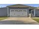 Attached garage features a white door and black hardware at 636 Ginger Mint Cir, Knightdale, NC 27545