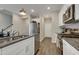 Well-designed kitchen with stainless appliances, granite countertops, and ample white cabinetry at 636 Ginger Mint Cir, Knightdale, NC 27545