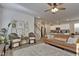 Inviting living room featuring stylish furnishings, a ceiling fan, and seamless flow to the kitchen area at 636 Ginger Mint Cir, Knightdale, NC 27545