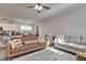Bright living room showcasing modern sofas, a patterned rug, and plenty of natural light at 636 Ginger Mint Cir, Knightdale, NC 27545