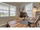 Bright office with a large desk, ergonomic chair, and natural light perfect for work or study at 636 Ginger Mint Cir, Knightdale, NC 27545
