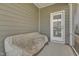 Screened-in porch with covered seating area, offering a relaxing outdoor space at 636 Ginger Mint Cir, Knightdale, NC 27545
