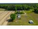 Aerial view of the property with a home, outbuildings and a large yard at 640 Short Journey Rd, Smithfield, NC 27577