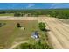 Expansive aerial view of property featuring a home, outbuildings, and surrounding farmland at 640 Short Journey Rd, Smithfield, NC 27577