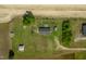 Overhead shot of a home surrounded by lush greenery with several outbuildings on a vast lot at 640 Short Journey Rd, Smithfield, NC 27577