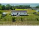 Aerial view of a fenced backyard with a shed, trees, and open space at 640 Short Journey Rd, Smithfield, NC 27577