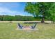 Backyard featuring a fire pit with Adirondack chairs at 640 Short Journey Rd, Smithfield, NC 27577