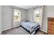 Small bedroom featuring carpeted floors and two windows at 640 Short Journey Rd, Smithfield, NC 27577