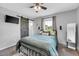Comfortable bedroom with a barn door, ceiling fan, and natural light at 640 Short Journey Rd, Smithfield, NC 27577