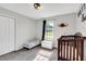 Bright bedroom with a crib, twin bed, and neutral decor at 640 Short Journey Rd, Smithfield, NC 27577