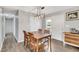 Cozy dining area with wooden table, four chairs, and ample natural light for Gathering meals at 640 Short Journey Rd, Smithfield, NC 27577