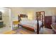 Comfortable bedroom featuring a four-poster bed, ample storage, and stylish decor at 708 Mills St, Raleigh, NC 27608