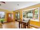 Dining room with hardwood floors, large bay window, and wooden table at 708 Mills St, Raleigh, NC 27608