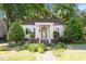 Charming single-story home with a welcoming front porch and beautifully landscaped front yard at 708 Mills St, Raleigh, NC 27608