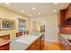 Well-lit kitchen features a center island, hardwood floors, and seamless flow to the inviting living areas at 708 Mills St, Raleigh, NC 27608
