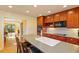 Bright, functional kitchen featuring a center island with seating and a view of the adjoining living spaces at 708 Mills St, Raleigh, NC 27608