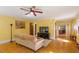 Living room with hardwood floors, ceiling fan, and an adjacent dining area at 708 Mills St, Raleigh, NC 27608