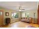 Inviting living room with hardwood floors, decorative sofa, and large windows that flood the space with natural light at 708 Mills St, Raleigh, NC 27608