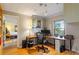 Bright home office with desk, storage, and a window overlooking the outdoors at 708 Mills St, Raleigh, NC 27608