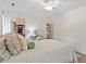 Spacious bedroom with ceiling fan, closet, and ample natural light at 7213 St Ledger Dr, Raleigh, NC 27613