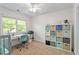 Bedroom has a desk and custom shelving for storage and organization at 7213 St Ledger Dr, Raleigh, NC 27613