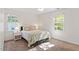 Cozy bedroom with two windows, neutral color palette, carpet, and ceiling fan at 7213 St Ledger Dr, Raleigh, NC 27613