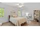 Bright bedroom with large window, ceiling fan, desk and bookcase at 7213 St Ledger Dr, Raleigh, NC 27613