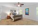 Bedroom with carpeted floors, ceiling fan, and natural light at 7213 St Ledger Dr, Raleigh, NC 27613