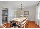 Charming dining room with wainscoting, chandelier, and natural light at 7213 St Ledger Dr, Raleigh, NC 27613