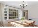 Inviting dining room featuring large windows and a view of the backyard at 7213 St Ledger Dr, Raleigh, NC 27613