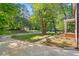 Front yard with blooming flowerbeds, sidewalk, and street at 7213 St Ledger Dr, Raleigh, NC 27613