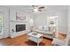 Living room featuring a fireplace, hardwood floors, and neutral decor at 7213 St Ledger Dr, Raleigh, NC 27613