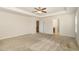 Spacious main bedroom features a tray ceiling and ceiling fan, with access to an ensuite bathroom and closet at 7508 Channery Way, Raleigh, NC 27616