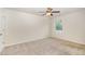 Comfortable bedroom with a ceiling fan and a large window, perfect for relaxation and rest at 7508 Channery Way, Raleigh, NC 27616