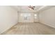 Large main bedroom with tray ceilings and neutral carpet boasts natural light and ample space at 7508 Channery Way, Raleigh, NC 27616