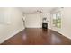 Spacious living room with hardwood floors, fireplace, and natural light streaming through large windows at 7508 Channery Way, Raleigh, NC 27616