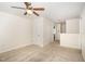 Upstairs loft area features neutral walls and carpet and great natural light, offering versatile living space at 7508 Channery Way, Raleigh, NC 27616