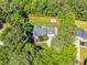 A peaceful home sits nestled among lush trees and features a large, grassy, fenced-in backyard at 76 Bergeson Ct, Fuquay Varina, NC 27526