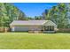 Backyard view featuring a screened porch and deck, perfect for enjoying the outdoors in comfort at 76 Bergeson Ct, Fuquay Varina, NC 27526