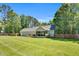 Expansive backyard with a covered deck, a screened in porch, and mature trees providing privacy and shade at 76 Bergeson Ct, Fuquay Varina, NC 27526
