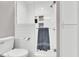 Modern bathroom showcasing a tiled shower with a glass door and updated fixtures at 76 Bergeson Ct, Fuquay Varina, NC 27526