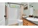Cozy bathroom with a shower-tub combo, wooden accents, and a neutral color palette at 76 Bergeson Ct, Fuquay Varina, NC 27526