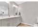 Bathroom with double vanity, hardwood flooring and bright lighting at 76 Bergeson Ct, Fuquay Varina, NC 27526